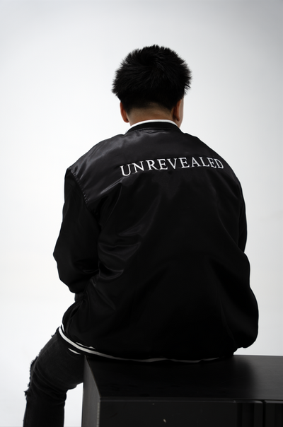 "UNREVEALED" VARSITY JACKET