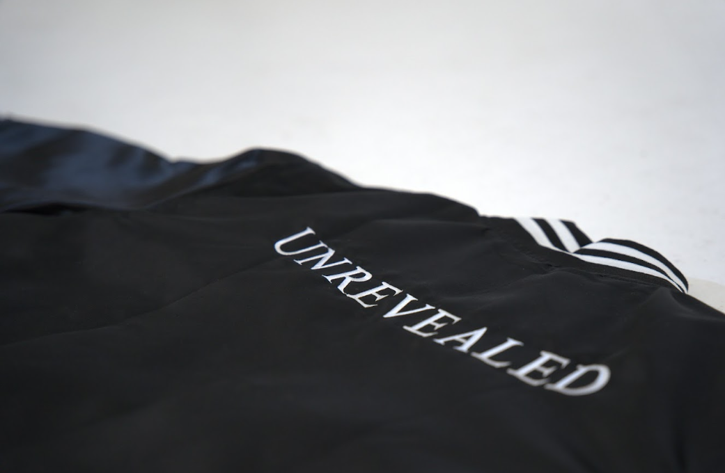 "UNREVEALED" VARSITY JACKET