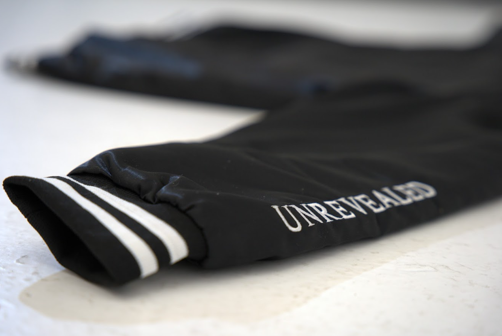 "UNREVEALED" VARSITY JACKET